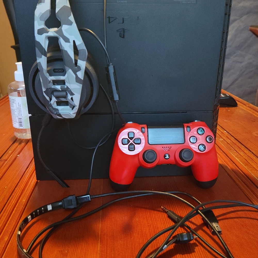 PS 4, with power cord, Hdmi, 1 remote, 1 TB External Hard Drive, and a headset.